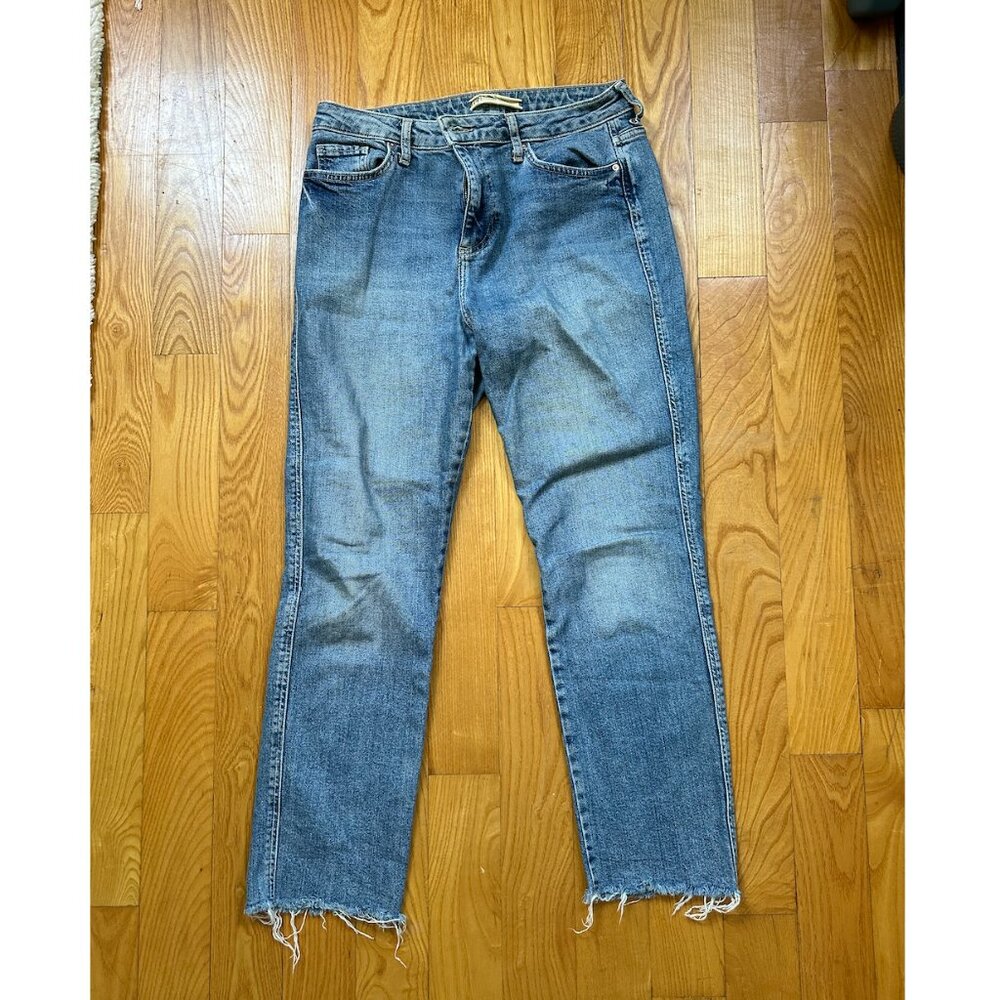 Free People blue jeans with distressed hem